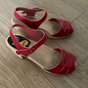 Red Swedish Hasbeens sandal clogs.